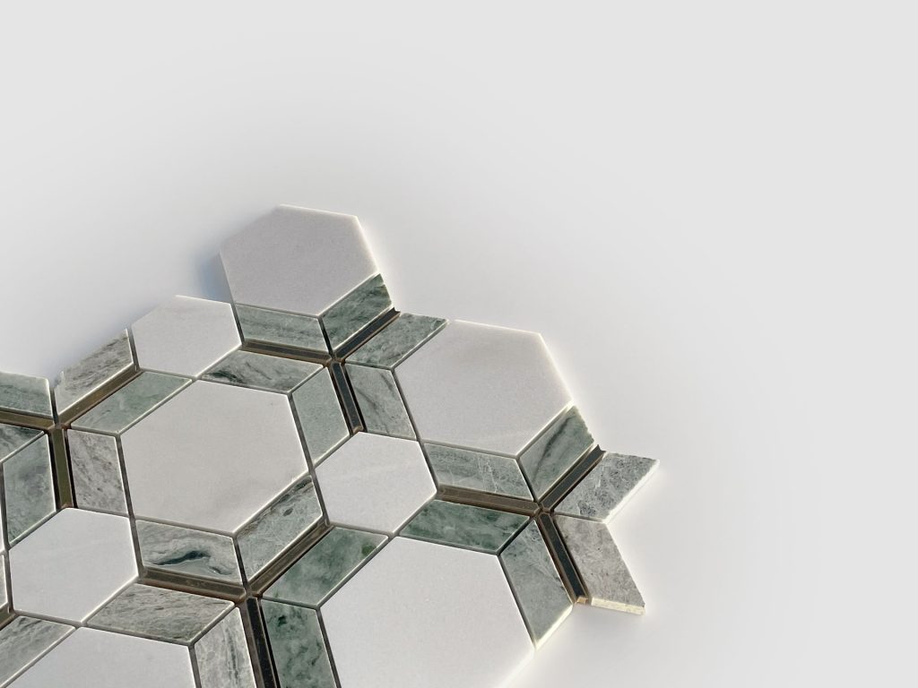 A geometric arrangement of hexagonal and rectangular tiles in white and greenish-gray tones, displayed on a light gray background. The pattern creates a visually striking, modern mosaic effect.